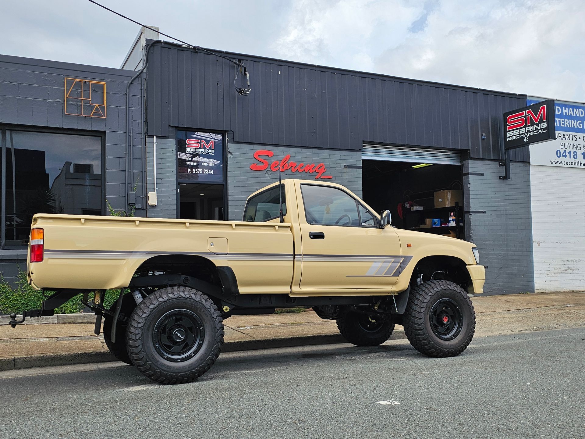 Yellow Truck with Suspension Lift β Sebring All Mechanical Repairs In Mermaid Beach, QLD