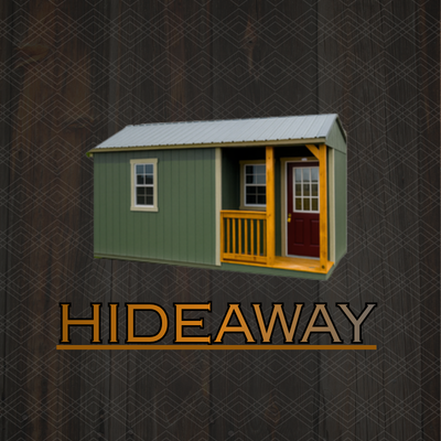 A green shed with a small porch, red door, and windows, set in a lush garden with a stone path leading to the entrance.