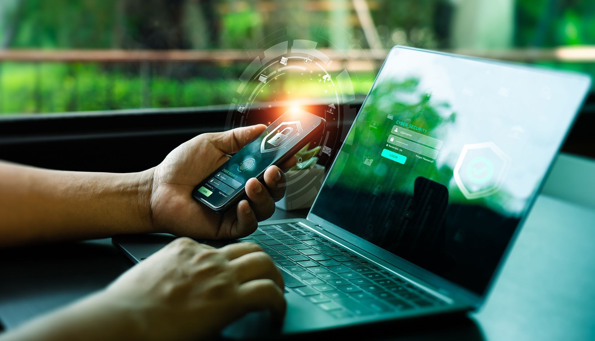 Person using laptop and smartphone. Holographic data overlay, green screen, outdoor setting.