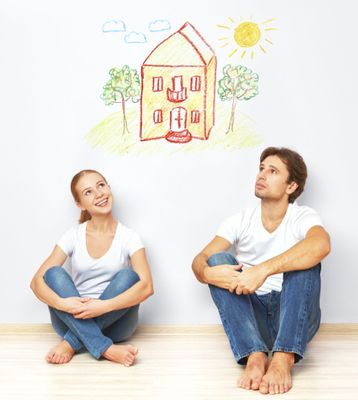 Concept: The housing and mortgage for young families. couple dreaming of his home
