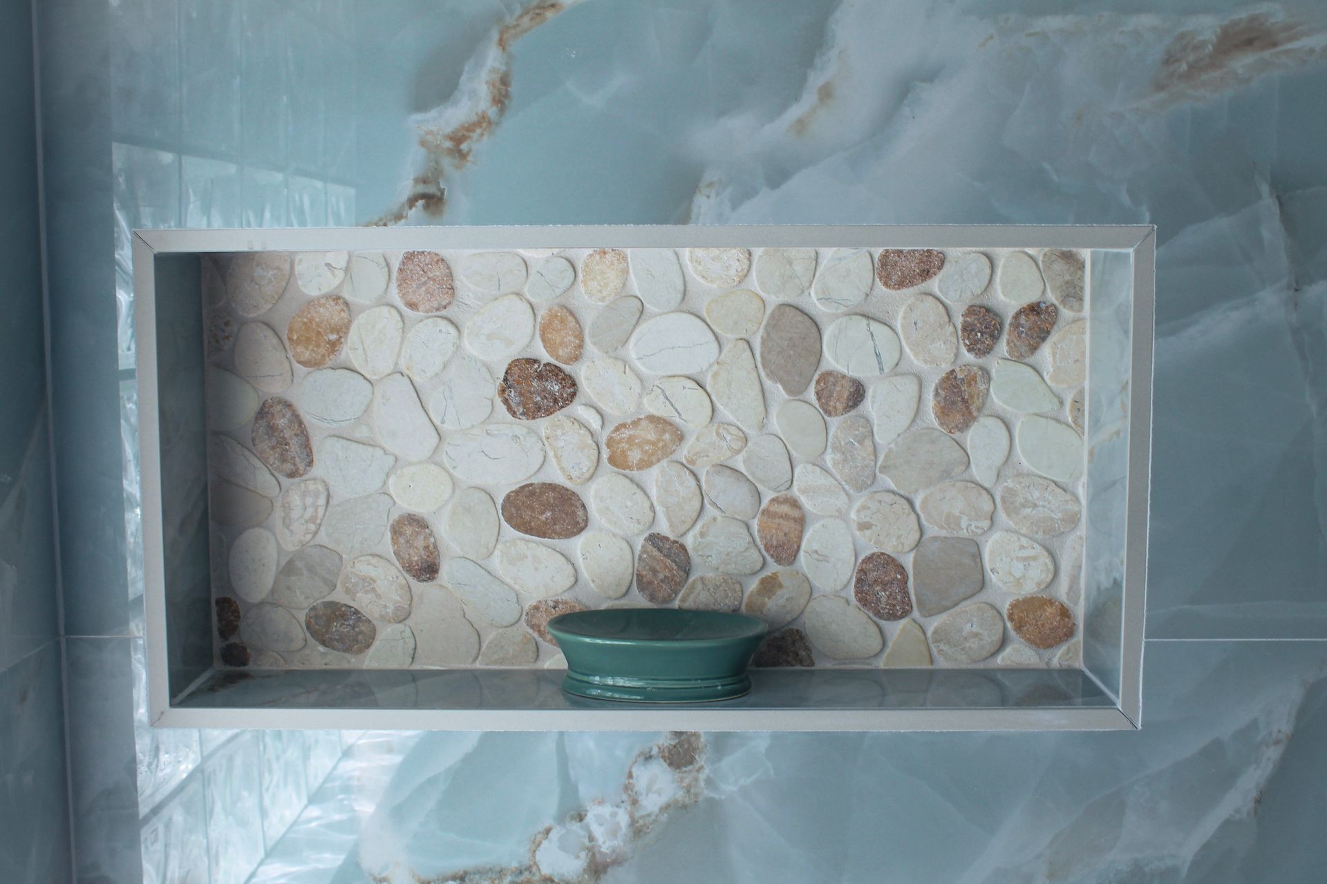 modern blue tile bathroom , white grout, steel and wood bench, Niche with white trims and pebble mosaic with modern soap holder