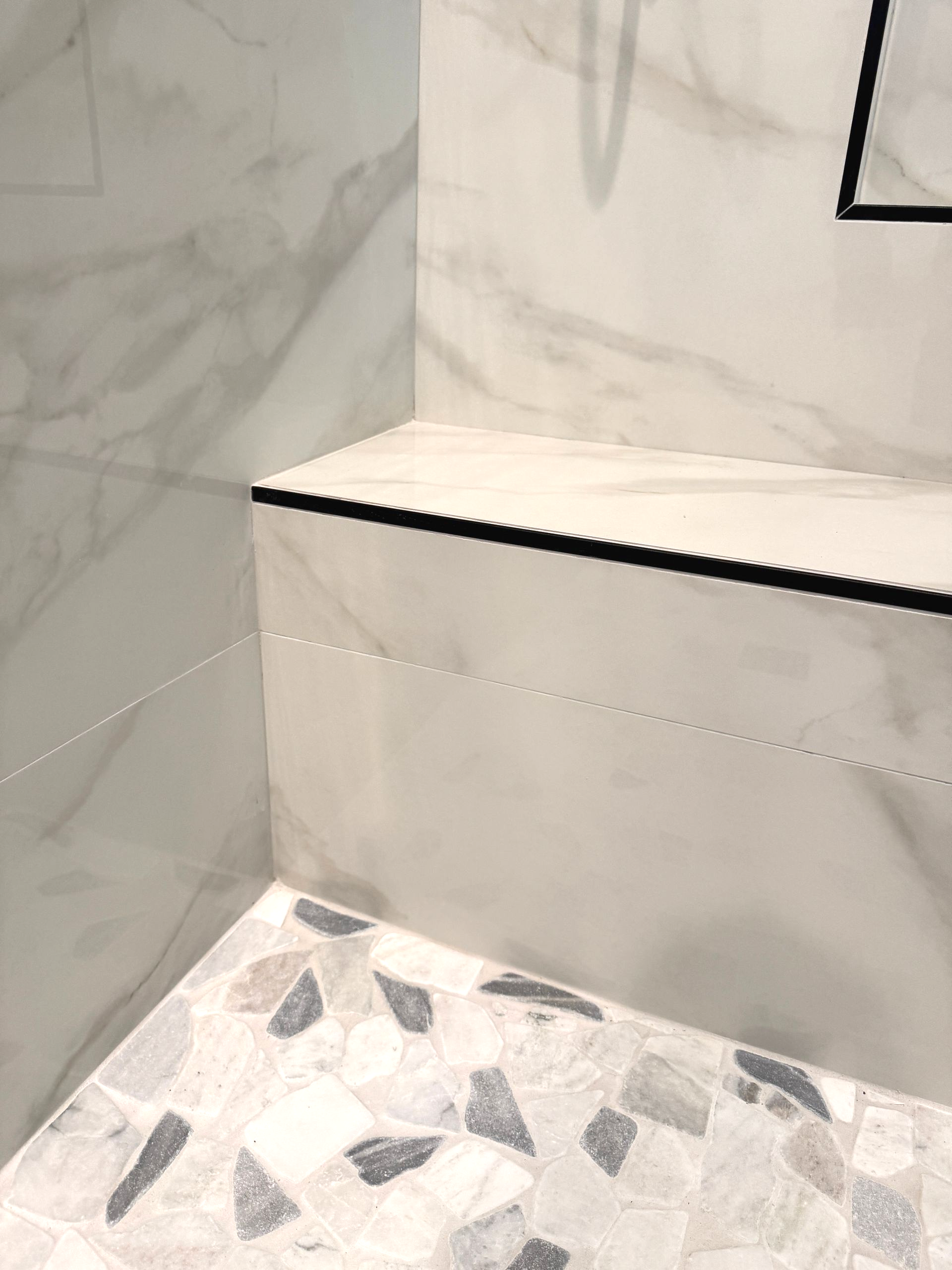 A close up of a tiled floor with a starfish on it.