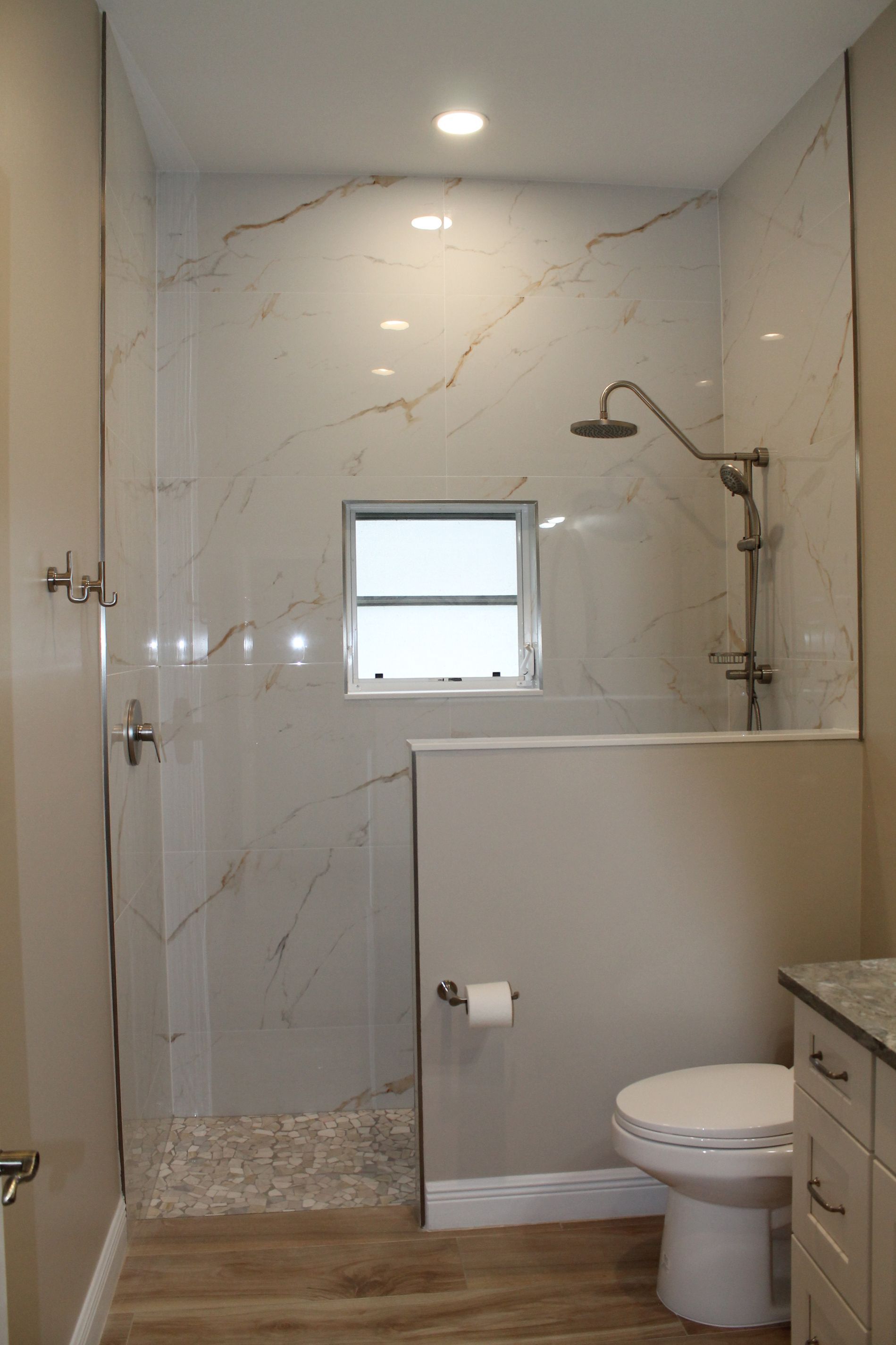 A bathroom with a toilet and shower