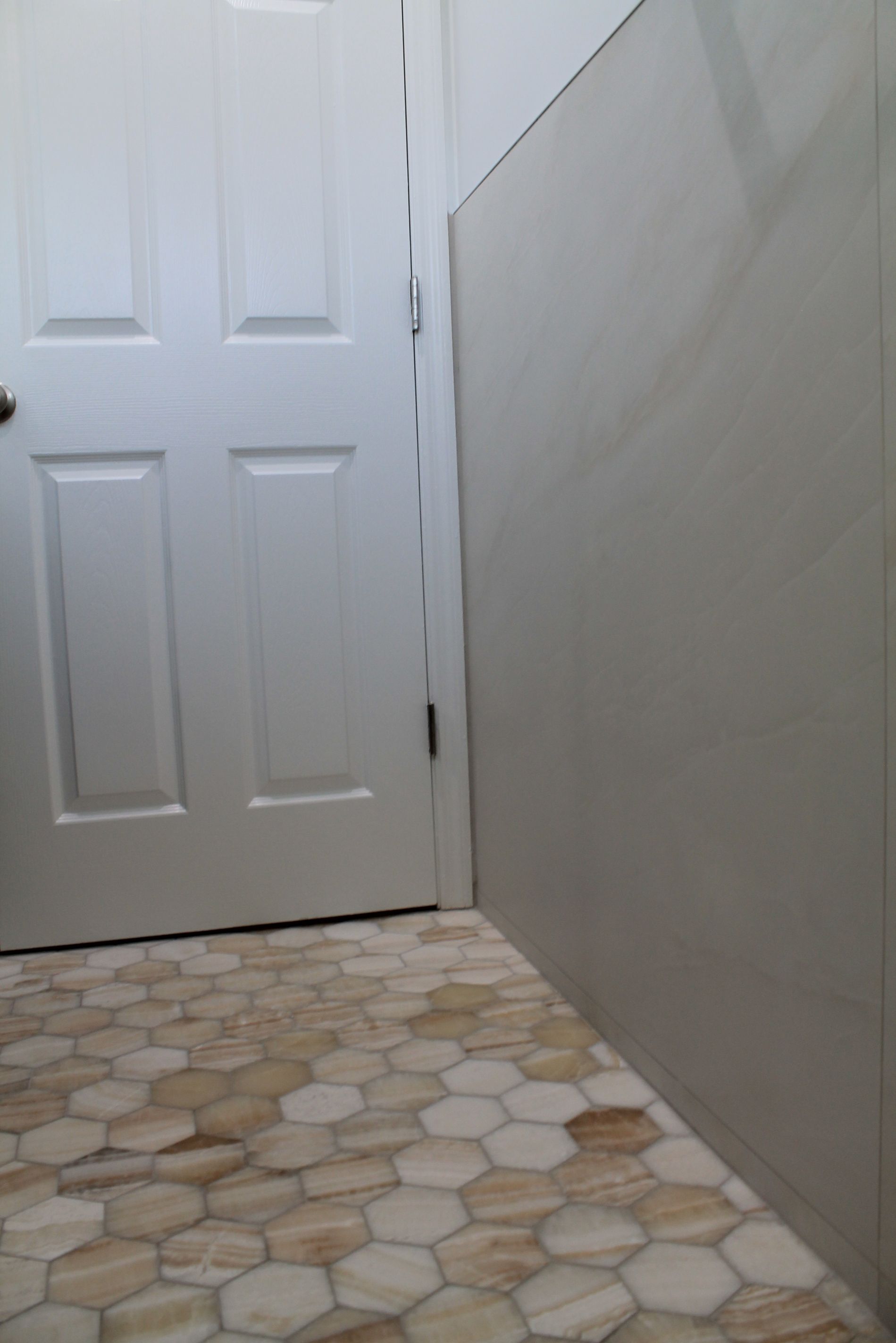 Updated bathroom with hexagon beige-orange tile floor