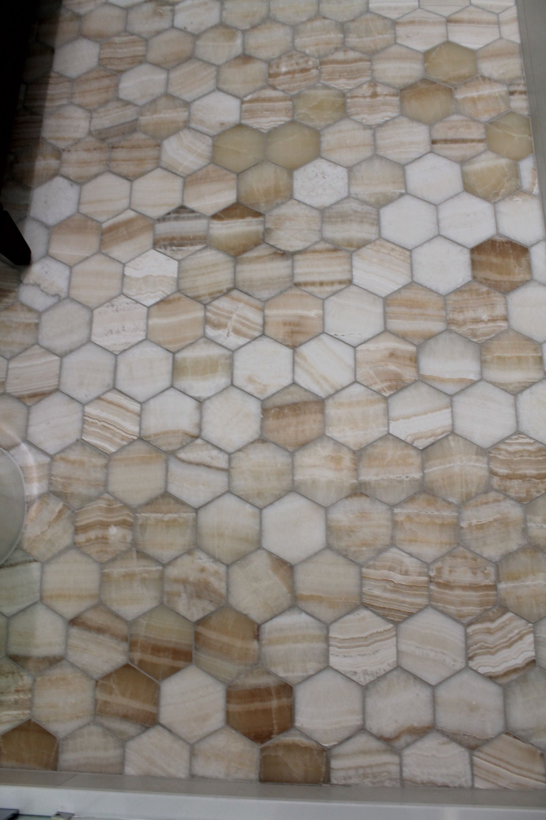 Updated bathroom with hexagon beige-orange tile floor