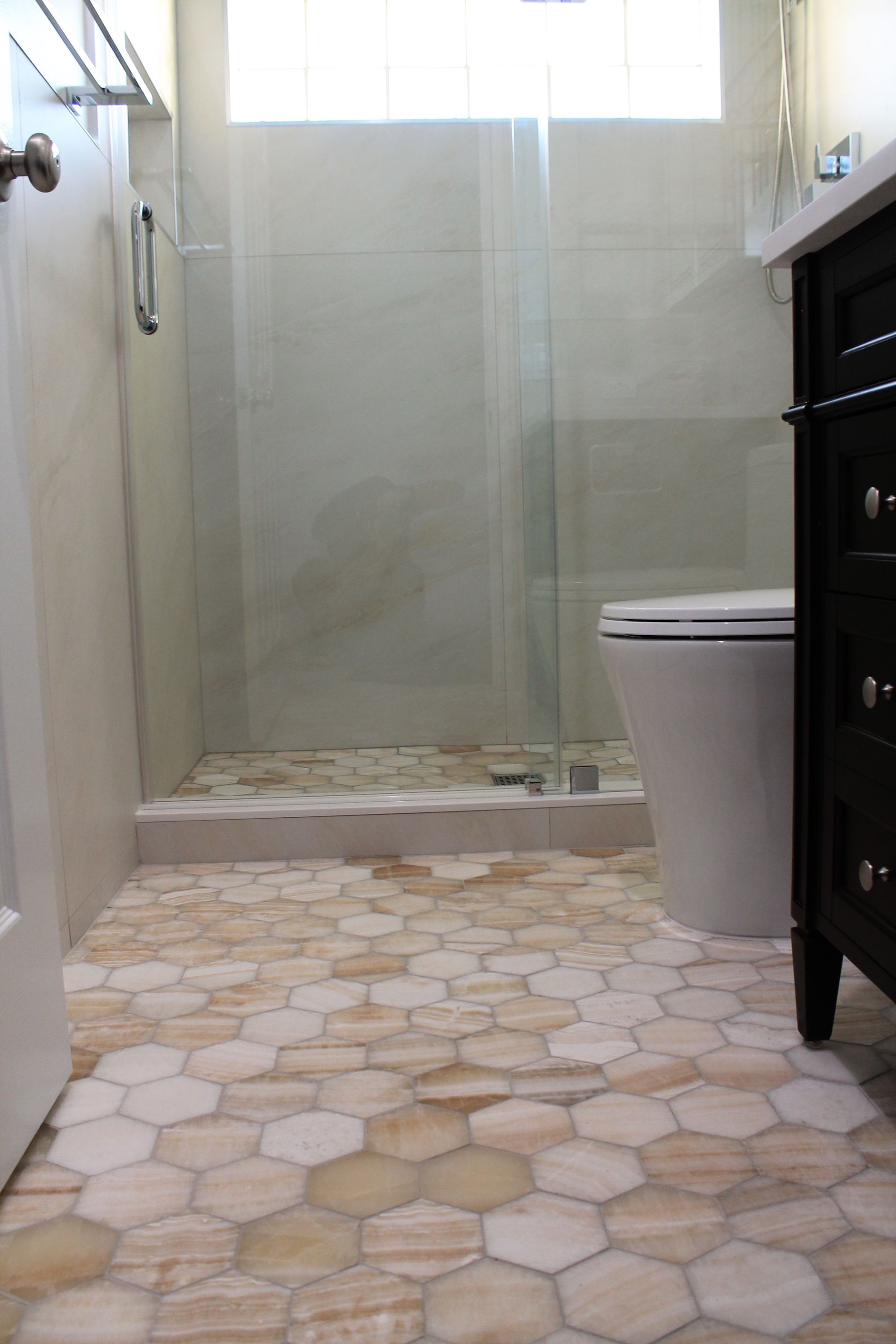 Updated bathroom with hexagon beige-orange tile floor