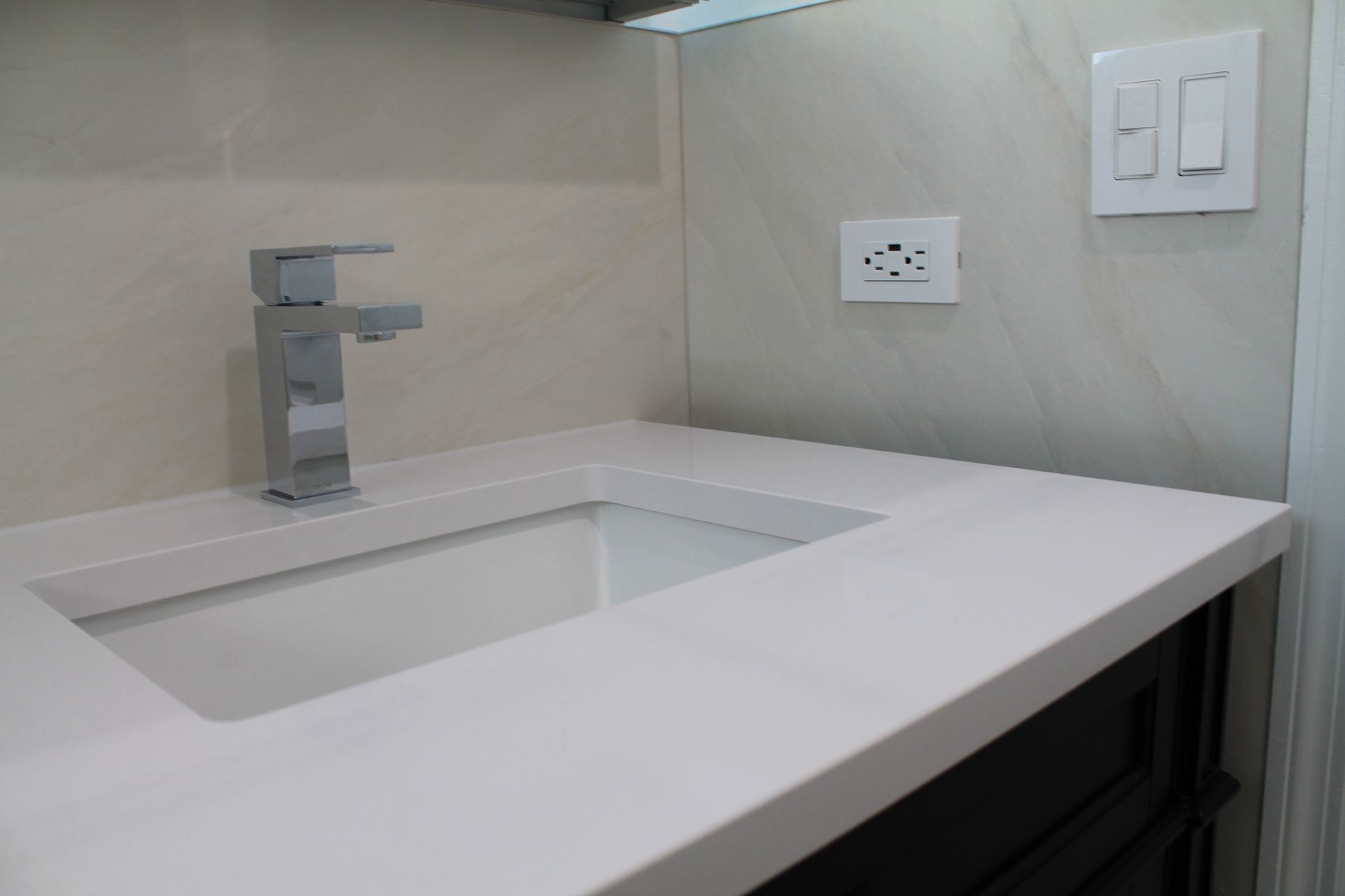 Bathroom remodel featuring a vanity with quartz countertop.