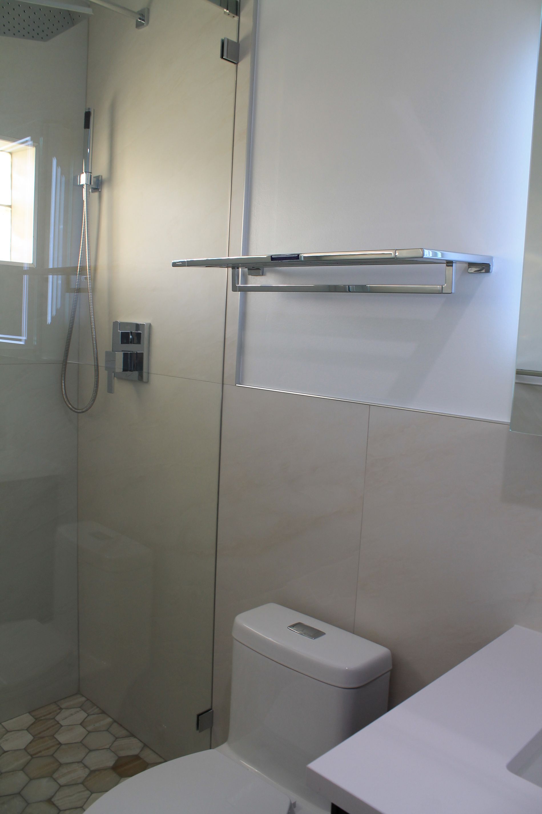 Bathroom remodel featuring a white toilet