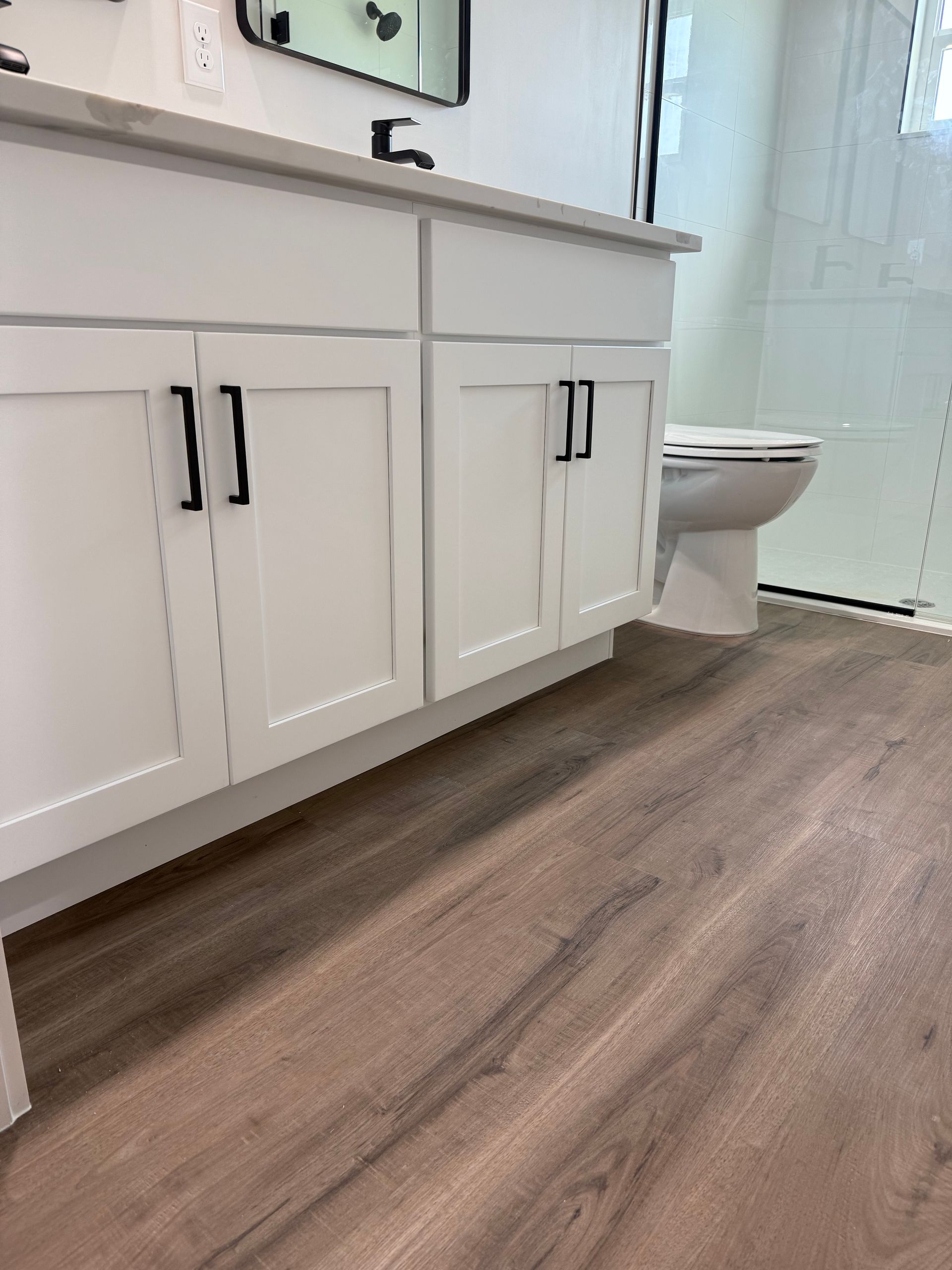 Cabinets on top of vinyl flooring
