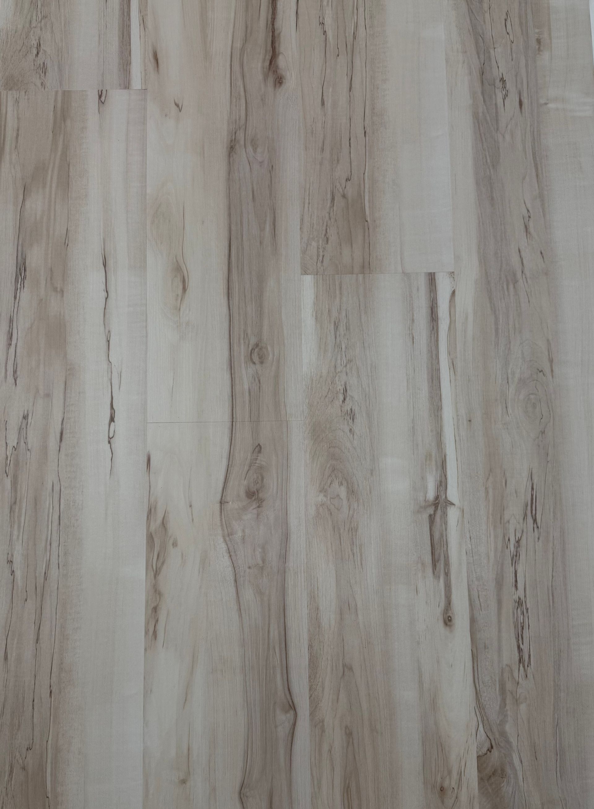 A close up of a wooden floor with a marble texture.