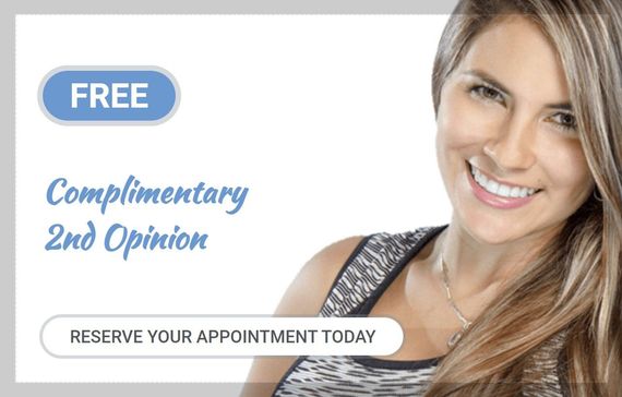 a woman is smiling and holding a sign that says free complimentary 2nd opinion