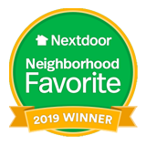 a green and yellow badge that says nextdoor neighborhood favorite 2019 winner .