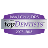 the logo for john j. cloud , dds is purple and silver .