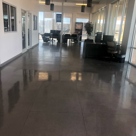 A large room with a lot of windows and chairs