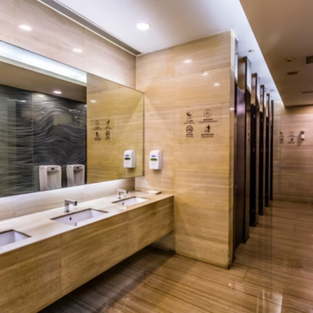 A bathroom with two sinks and a large mirror