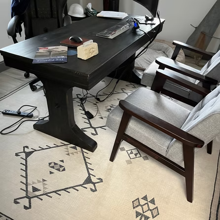 A chair sits next to a desk in a room