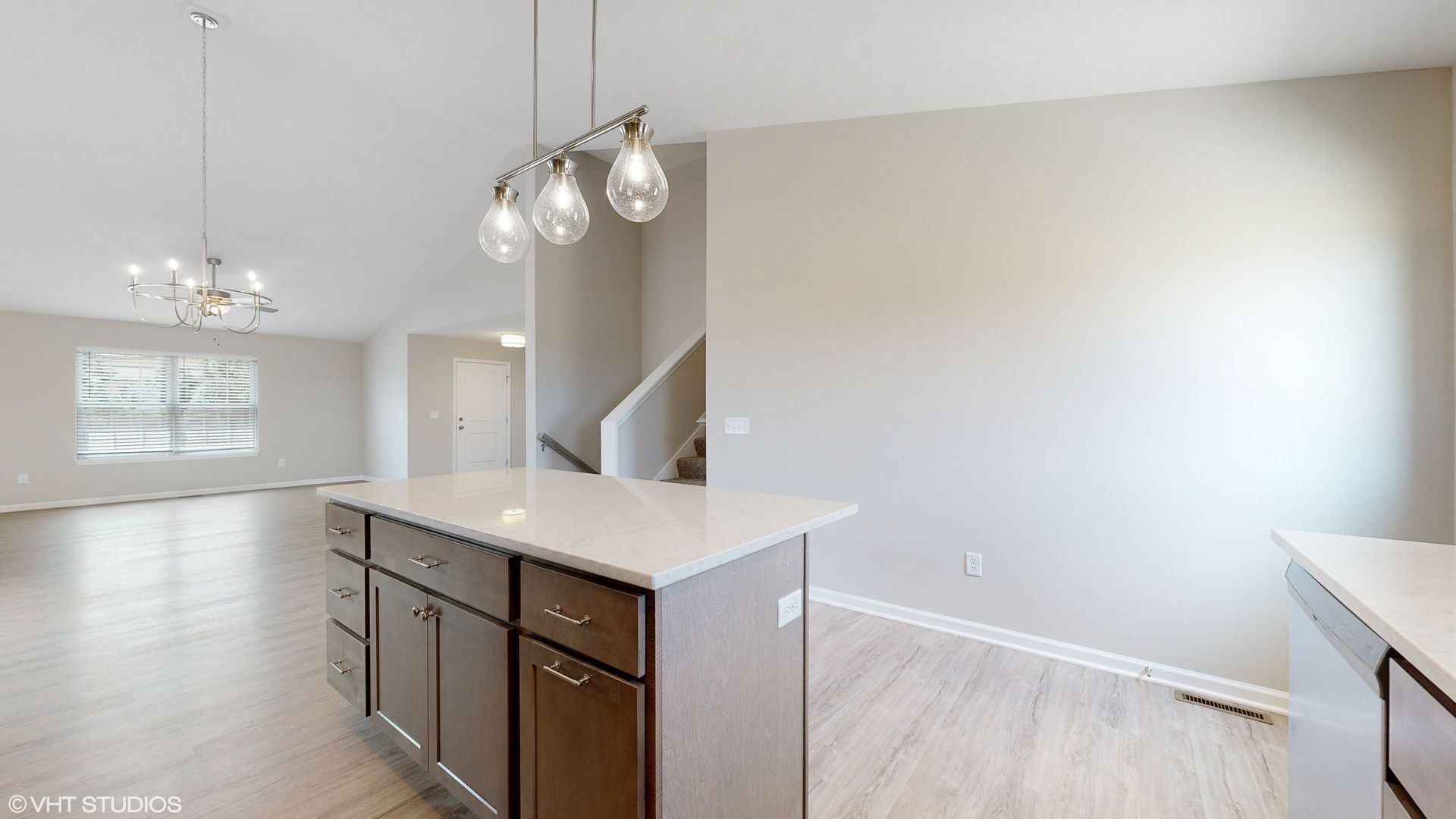 A kitchen with a large island in the middle of the room.