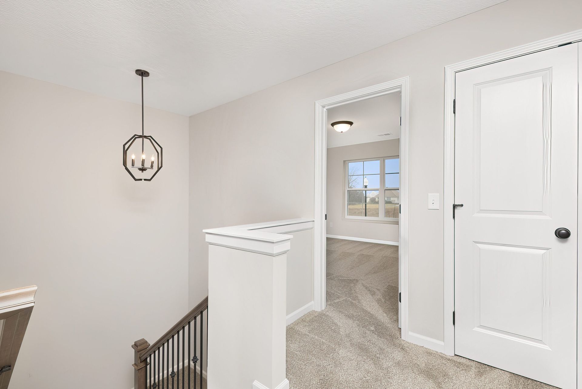 There is a staircase leading up to the second floor of a house.