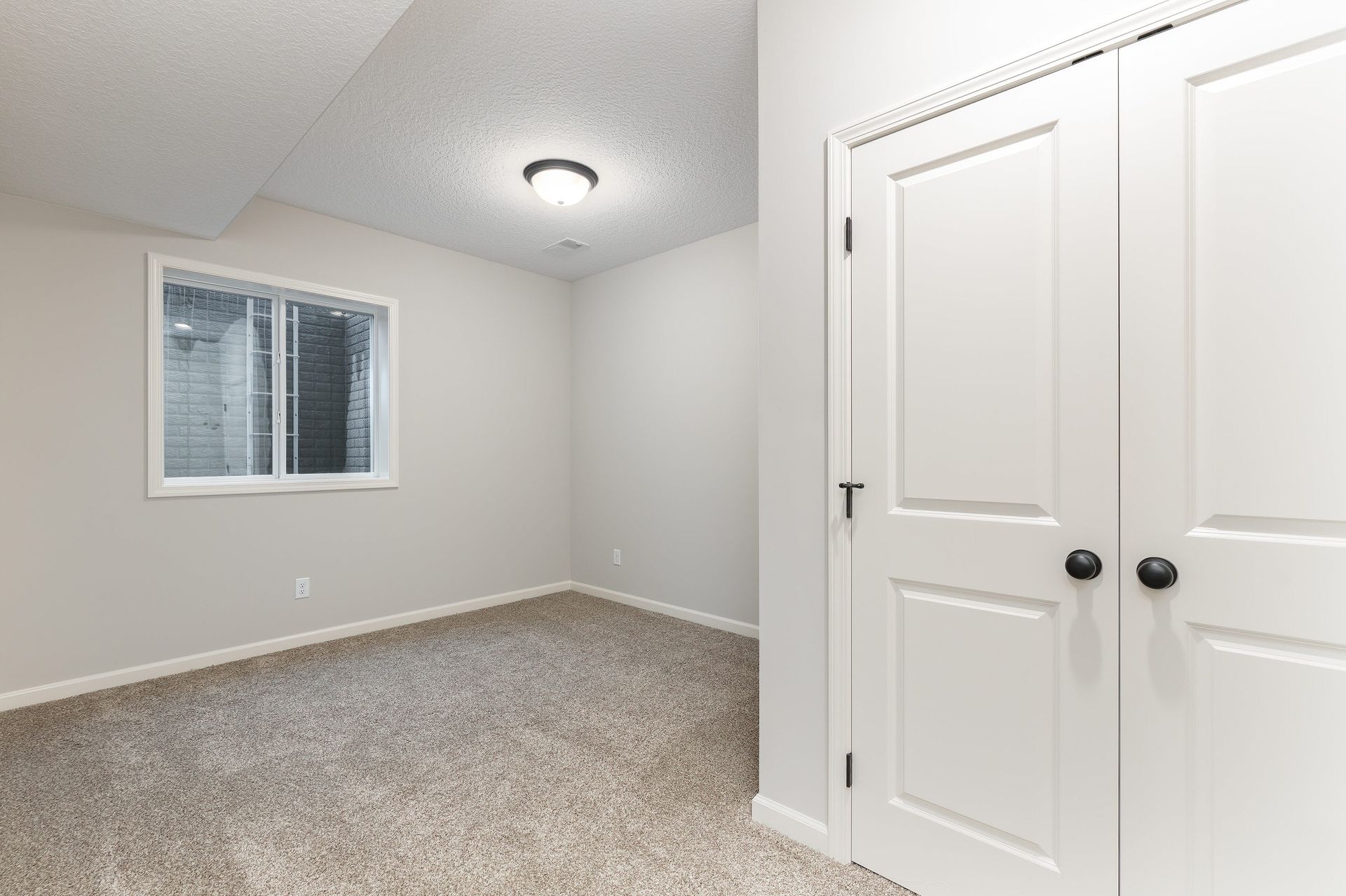 There is a window in the corner of the room.