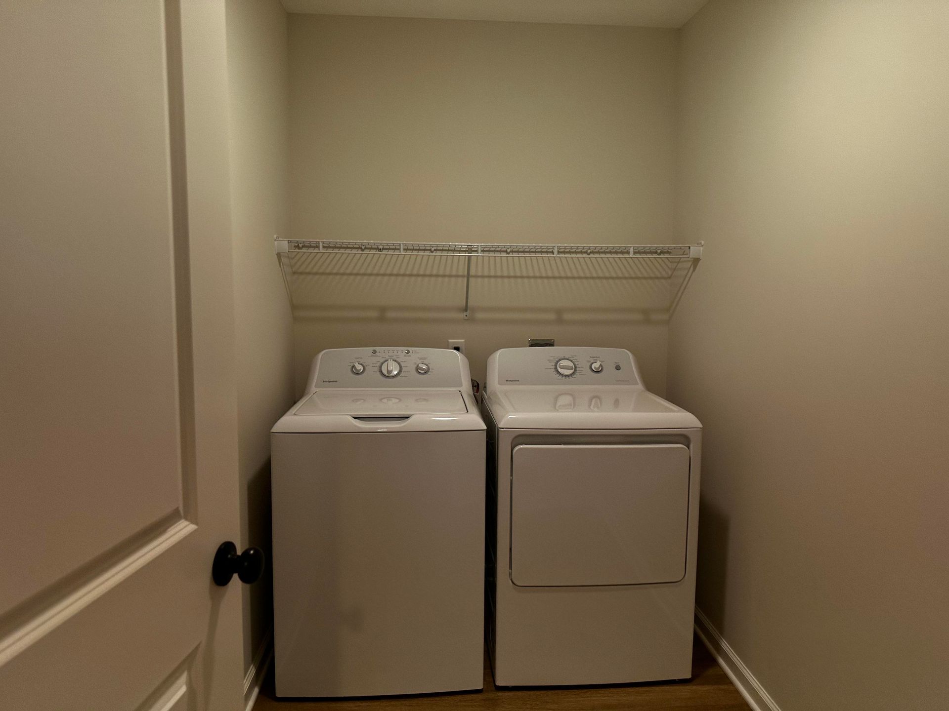 A laundry room with a washer and dryer in it