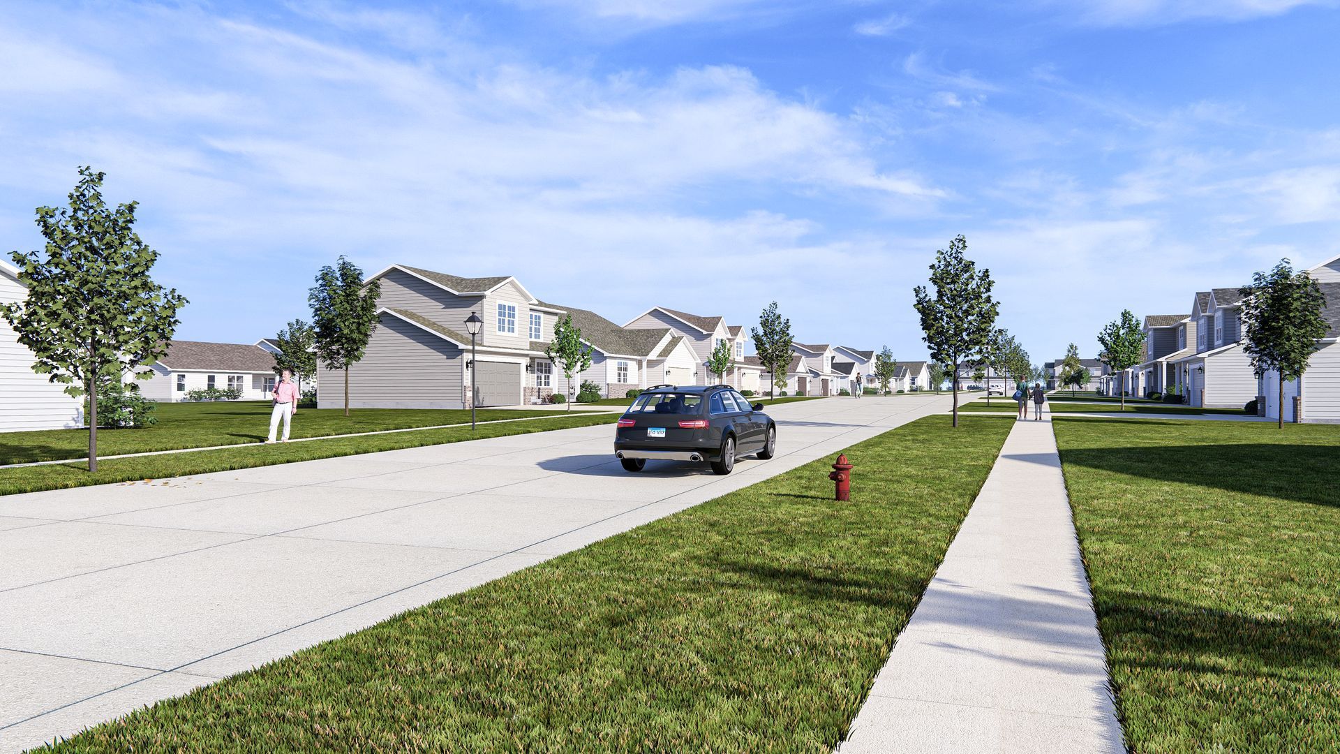 A car is driving down a street in a residential area.