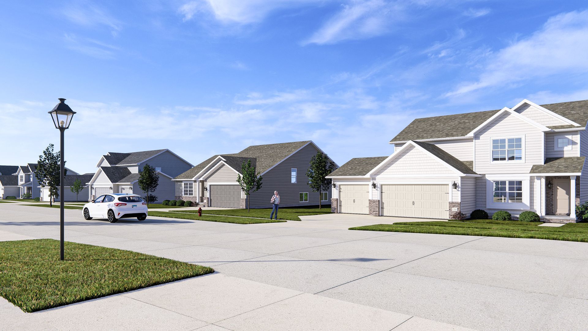 A white car is parked in a driveway in front of a row of houses.