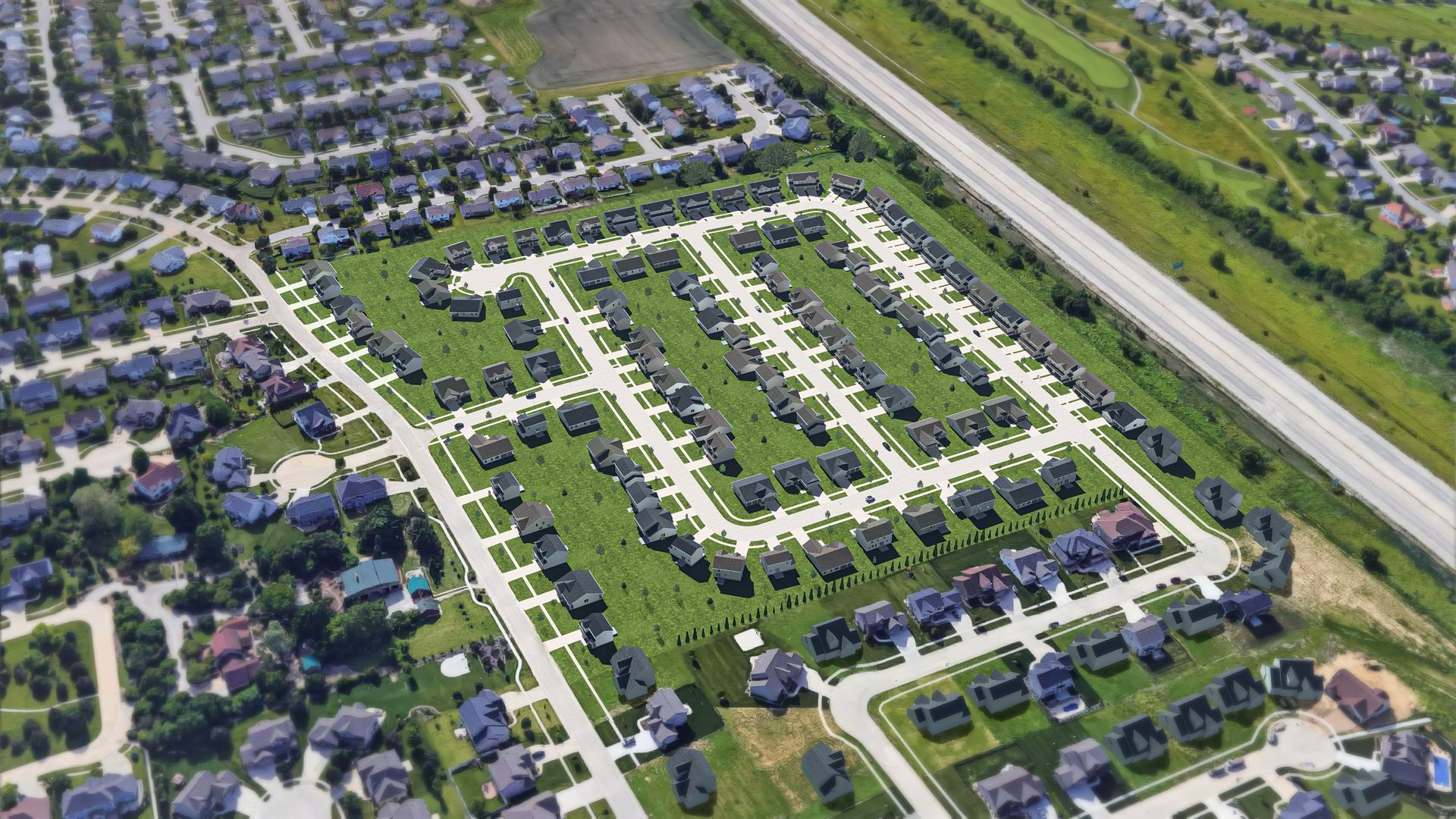 An aerial view of a residential area with lots of houses and a highway.