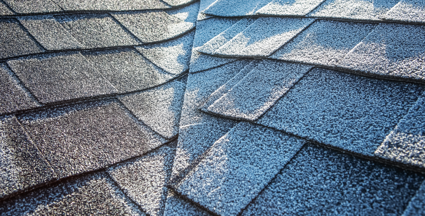 A close up of a roof with shingles on it.