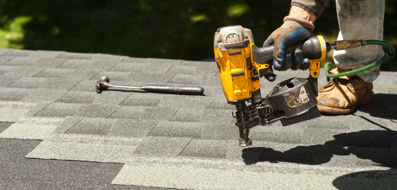 man working on a roof