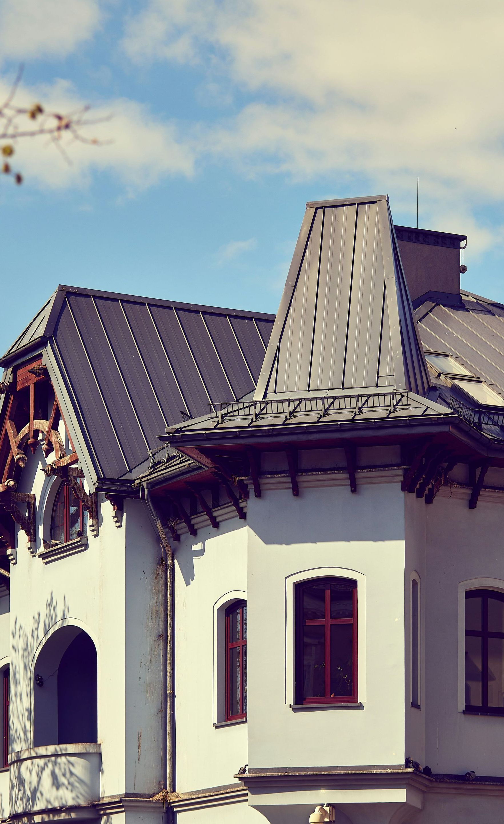 A large white house with a black roof