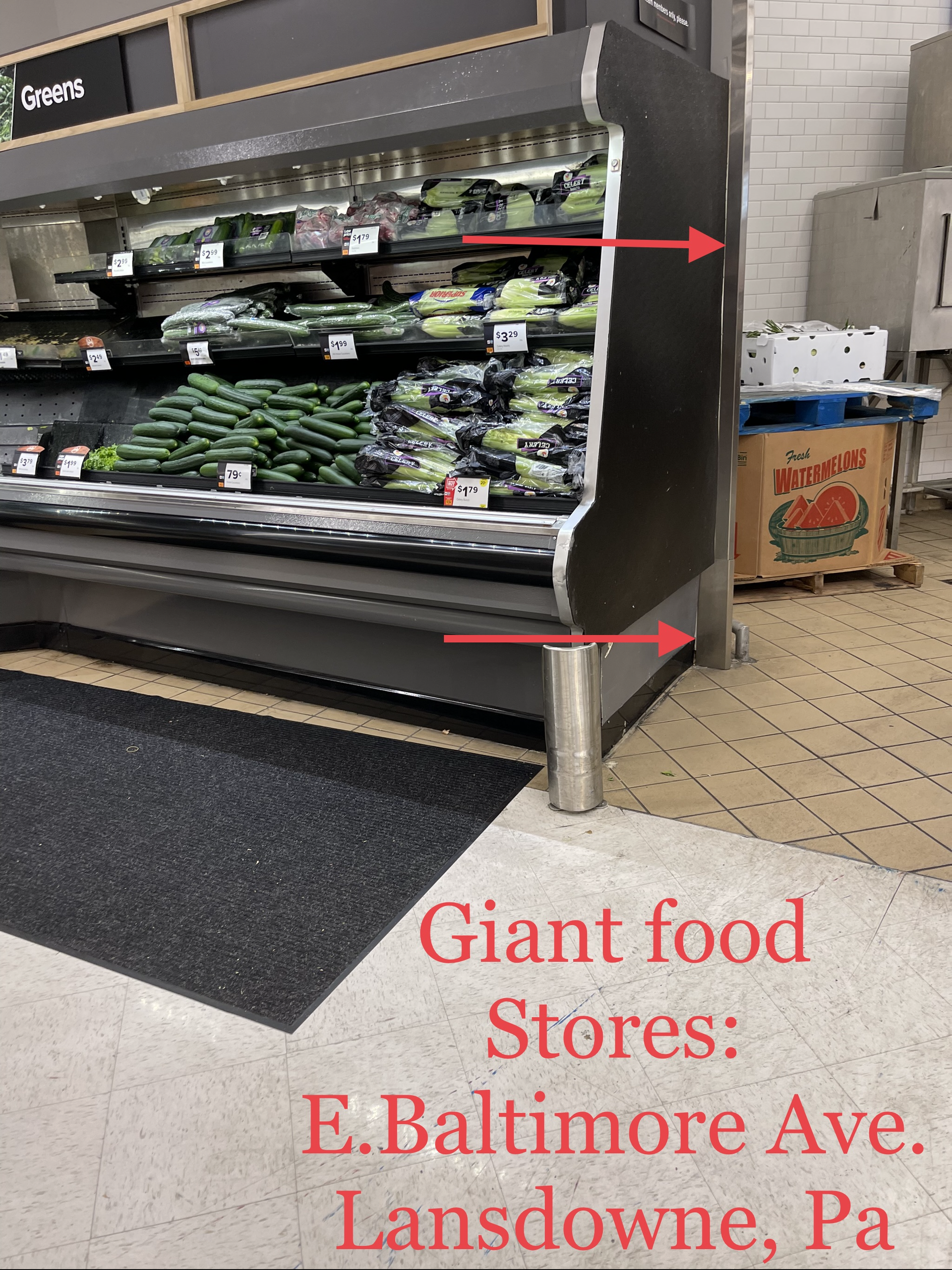 Produce aisle endcap at Giant Food, with arrows marking a narrow gap beside the display.
