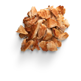 A pile of chopped chicken on a white background