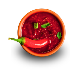 A bowl of sauce with a red pepper in it