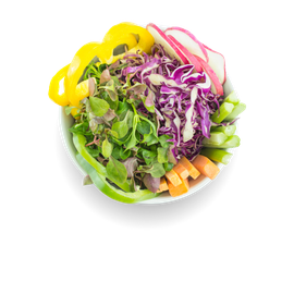 A salad with cabbage , carrots , green peppers and other vegetables in a bowl on a white background.