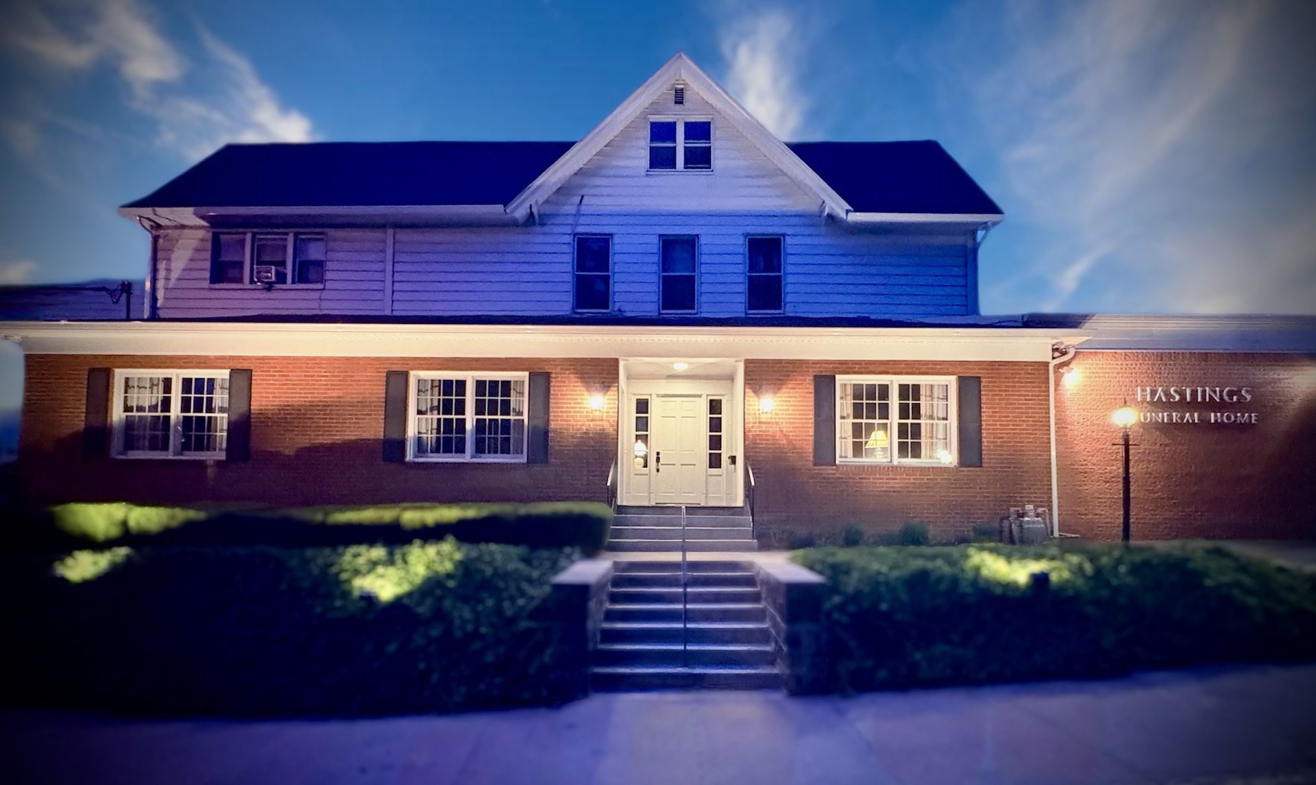 An aerial view of a river flowing through a valley surrounded by trees.