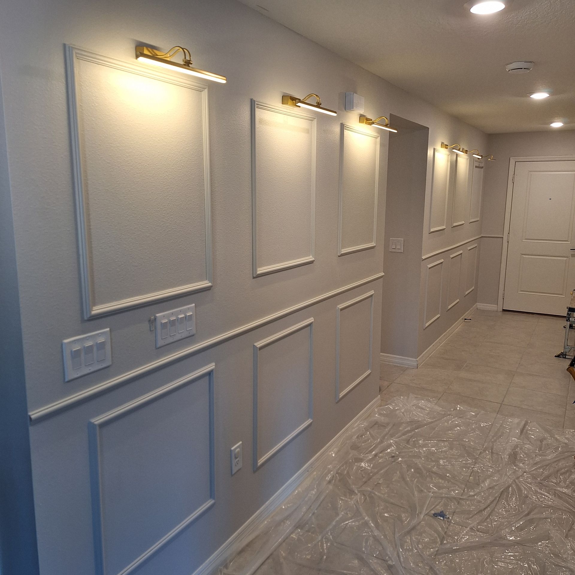 A hallway with a lot of molding on the walls