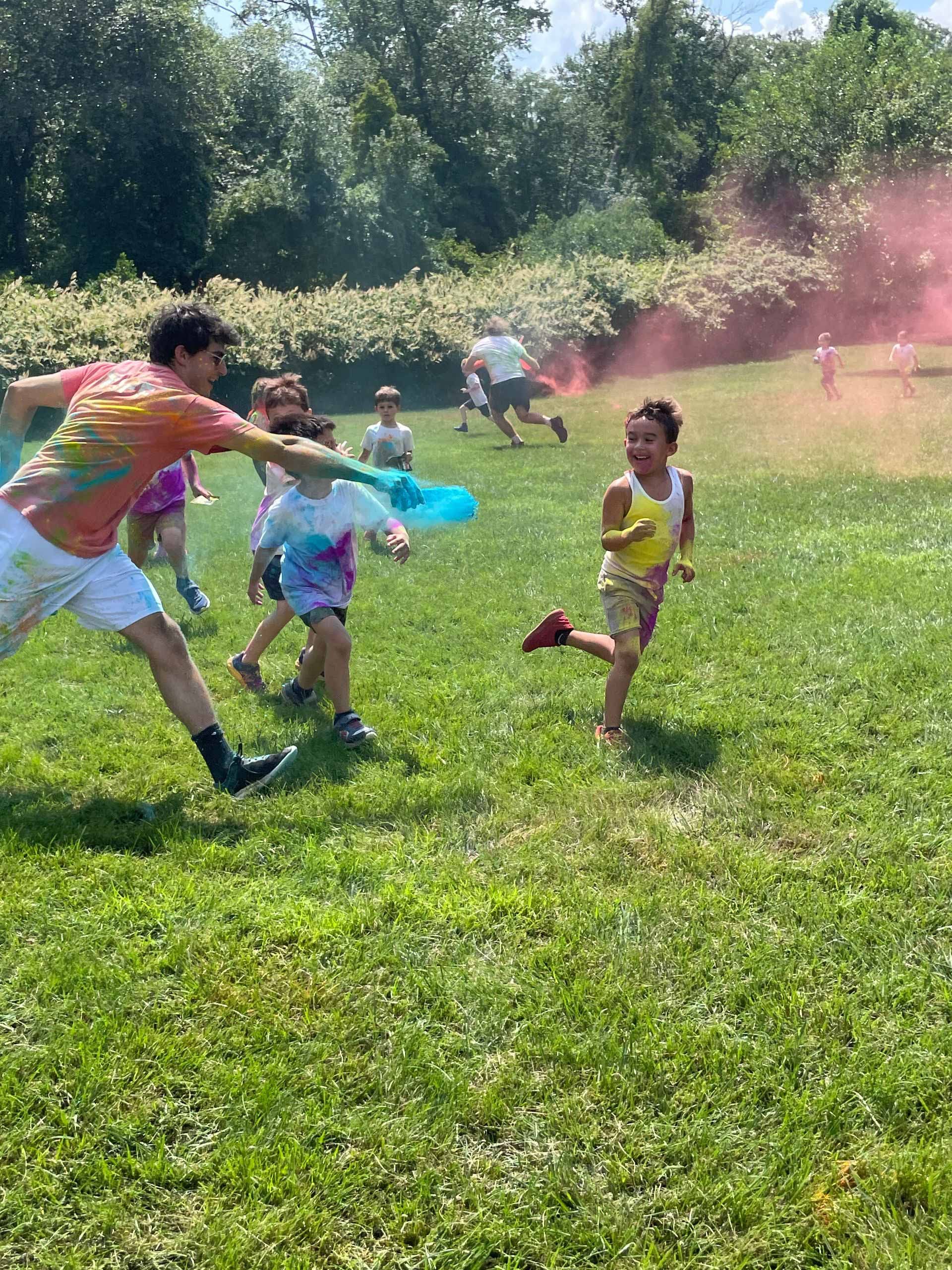 A group of people are playing frisbee in a field.