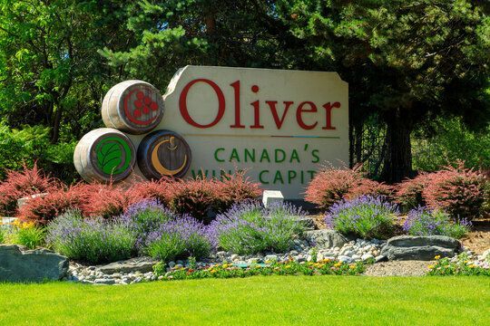 A sign that says oliver canada 's wine capital
