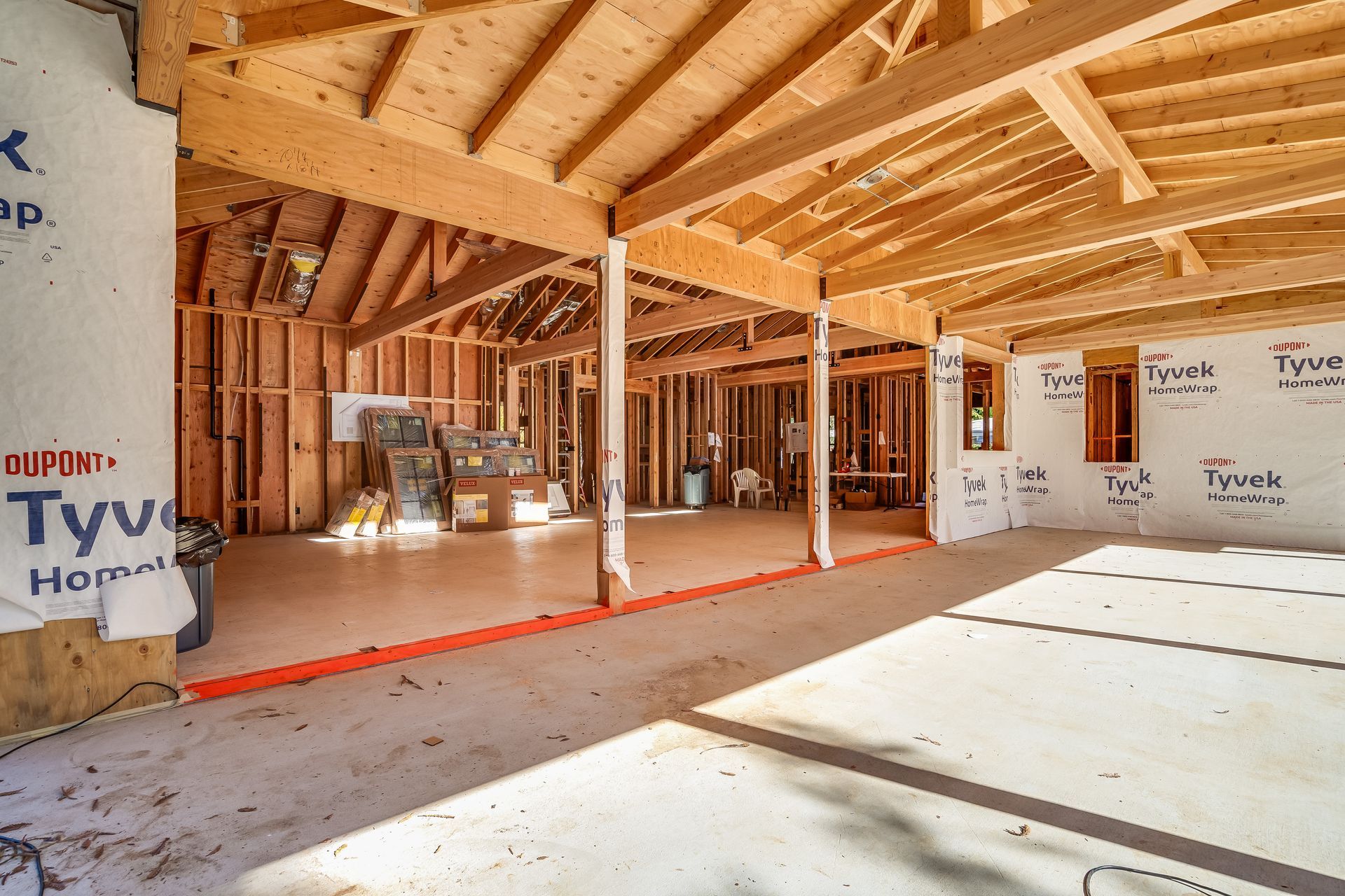 Interior of a building under construction. Exposed wooden beams and framing.