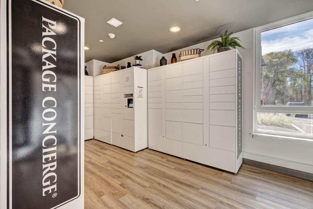 A room with a sign that says package concierge on it.