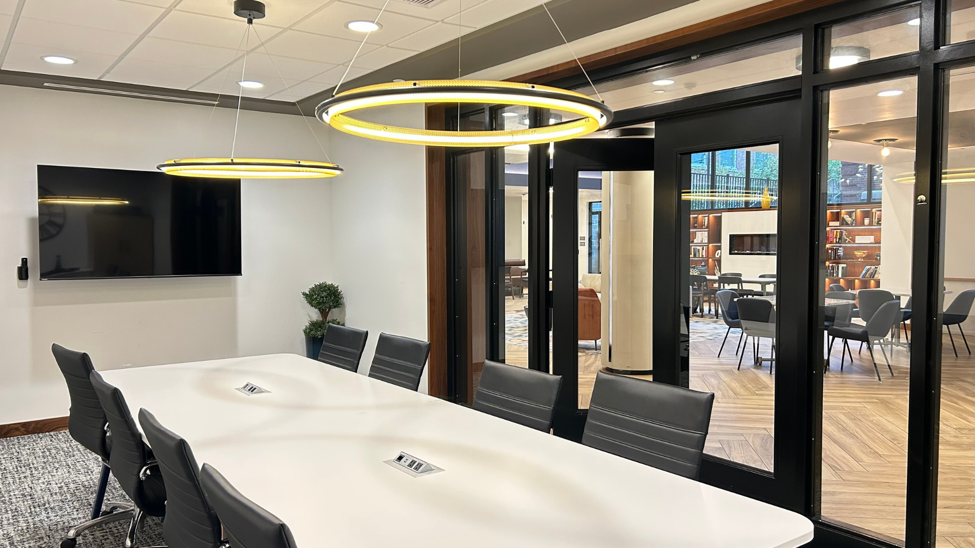 There is a ping pong table in the middle of the room.