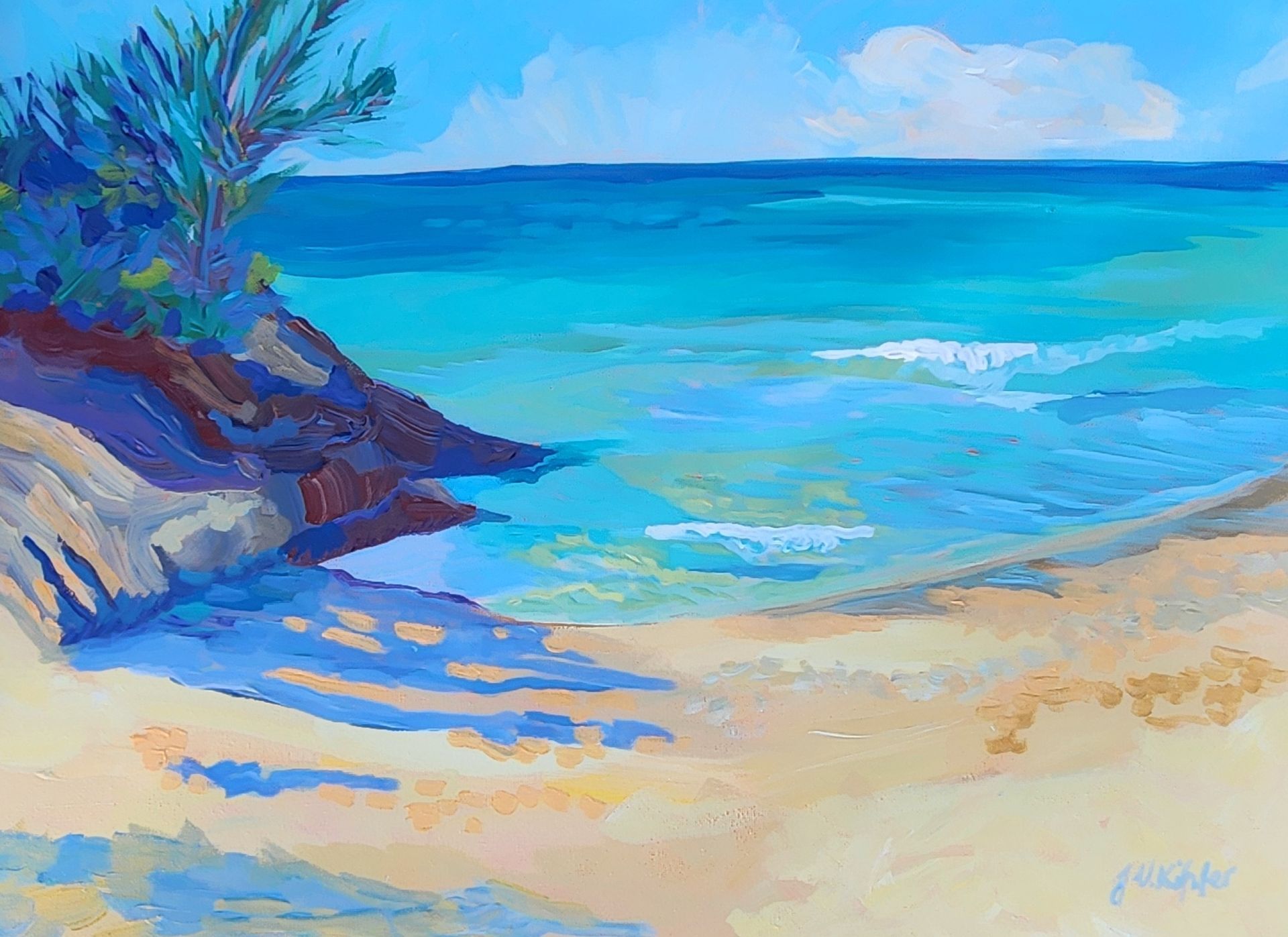 Beach scene. Turquoise water meets golden sand under a blue sky. Rocks and greenery frame the shore.