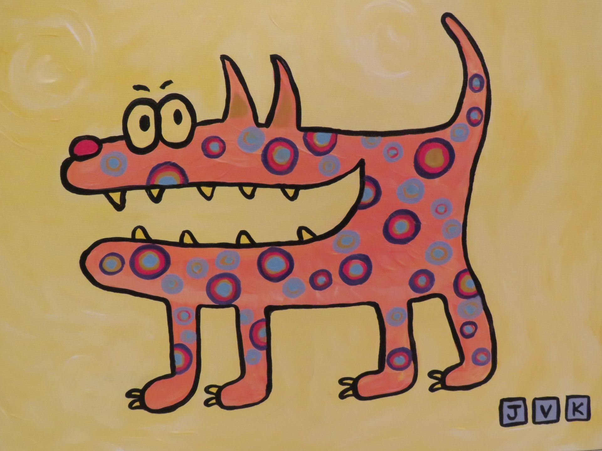 Orange cartoon dog with large teeth and polka dots on yellow background.
