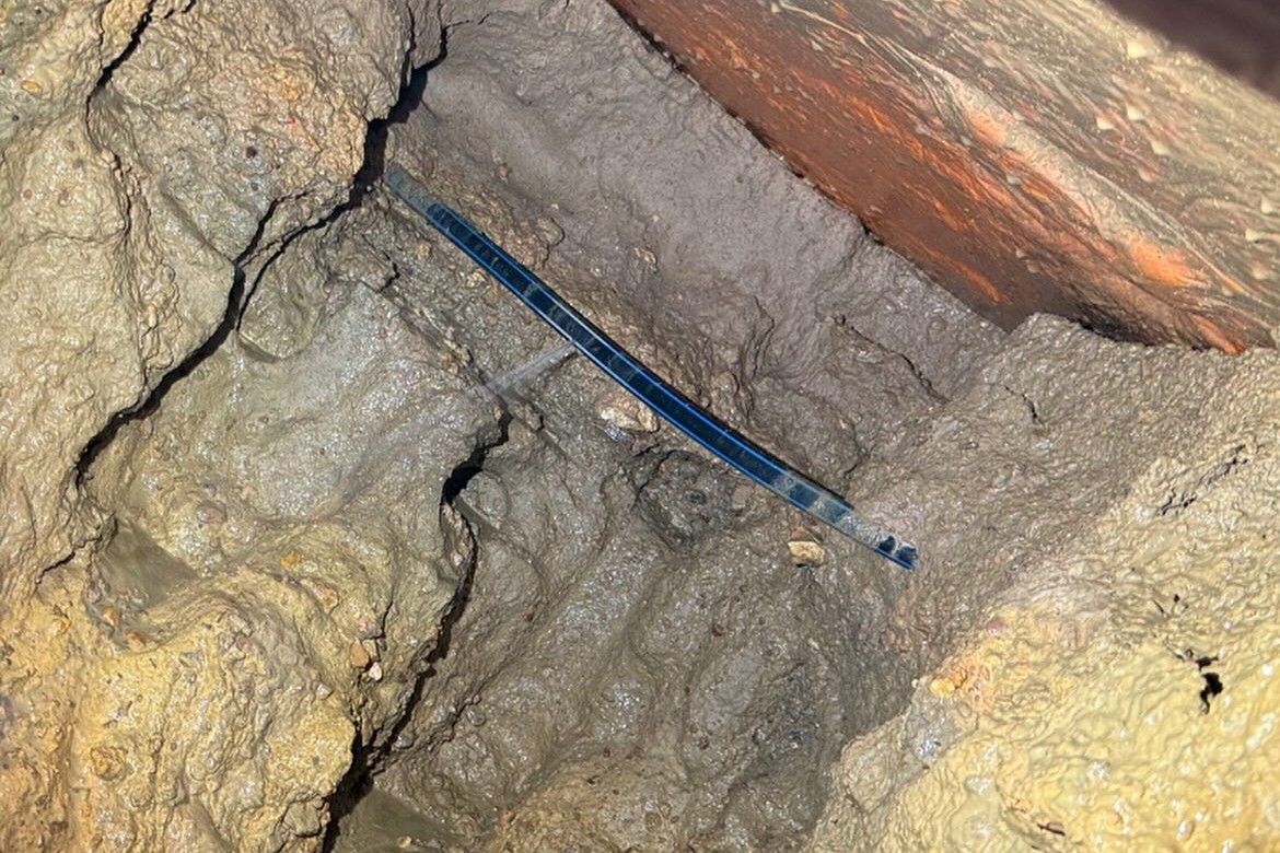 A Broken Pipe With Water Rushing Out