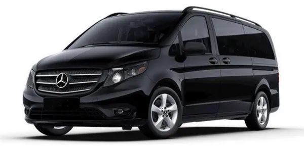 A black mercedes van is parked on a white background.