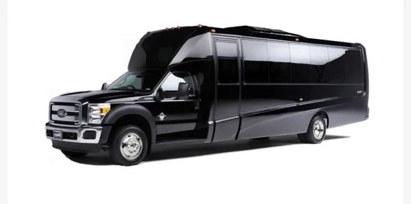 A black shuttle bus is parked on a white background.