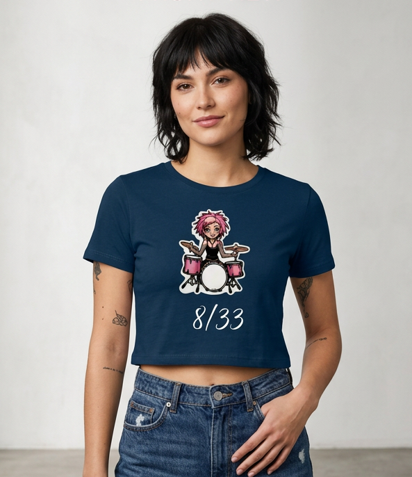 Woman modeling a navy cropped T-shirt with a cartoon graphic and “8/33” text