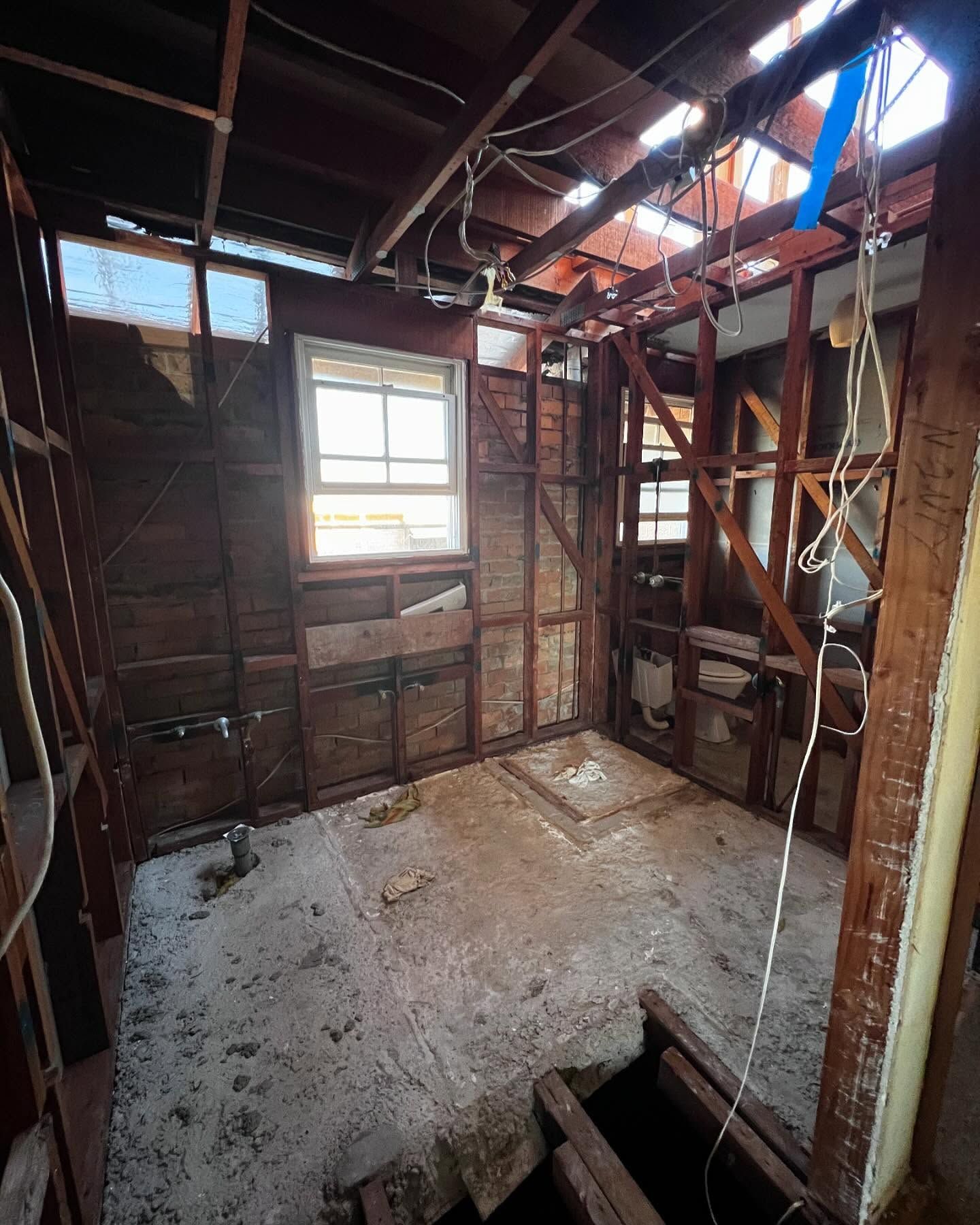 Interior of a Room Under Construction, With Exposed Wooden Studs — Ecowave Solutions In Gosford, NSW