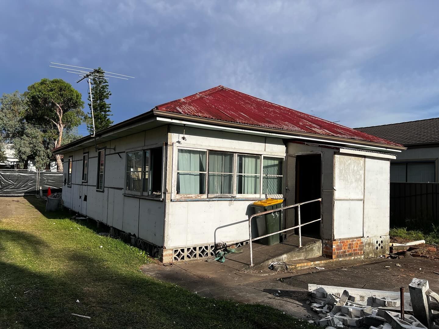 Weathered, Single-story House With a Red Roof — Ecowave Solutions In Gosford, NSW