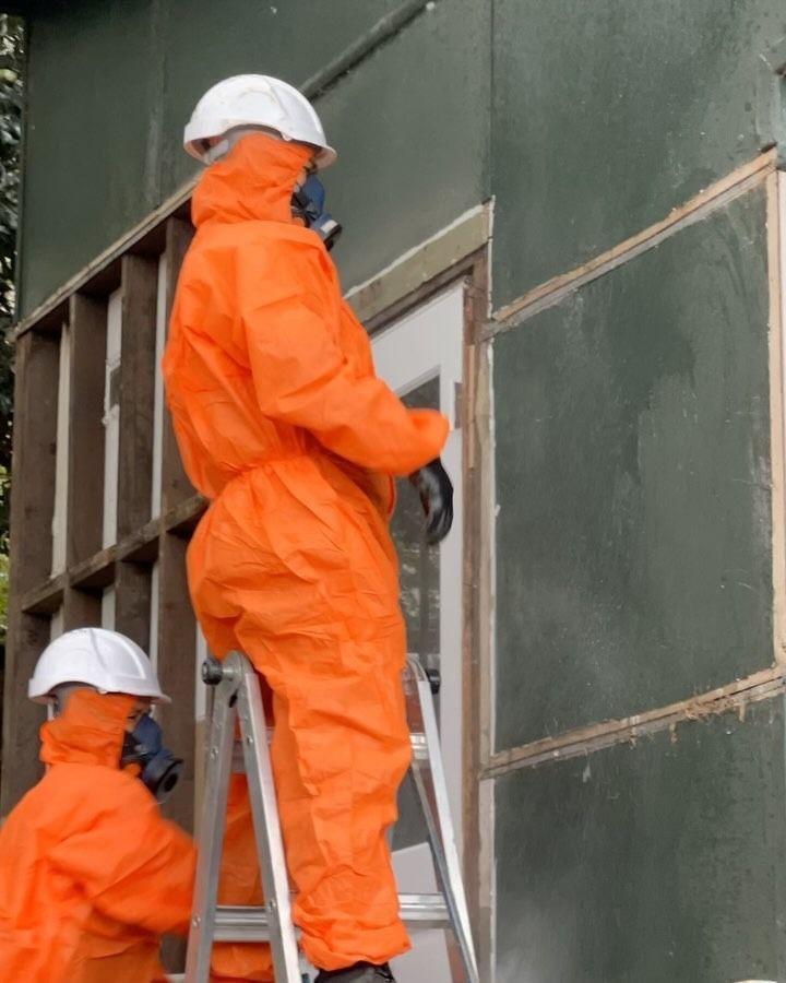 Two People in Orange Protective Suits and White Helmets — Ecowave Solutions In Sydney, NSW